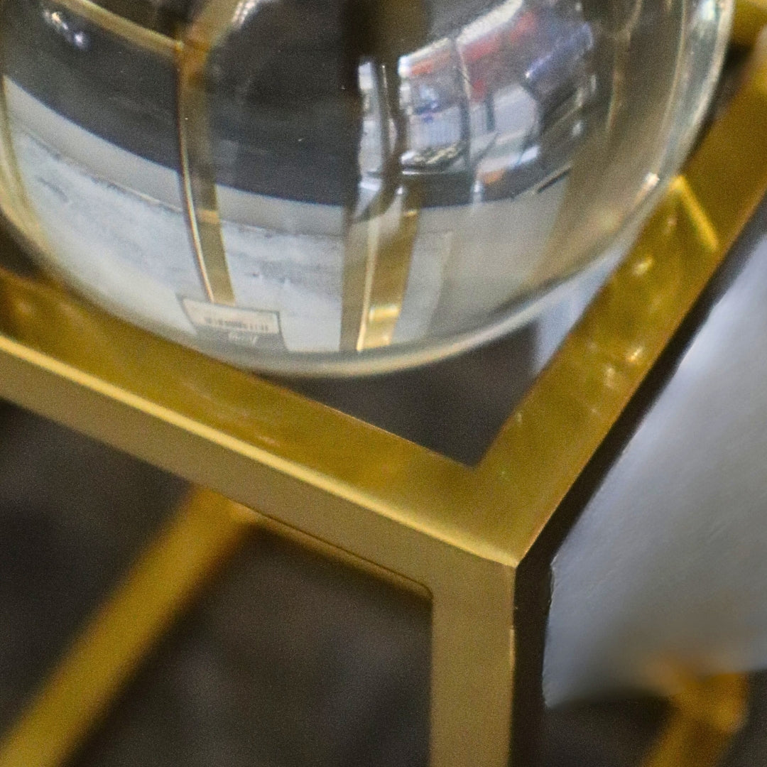 Gold-framed mirror with a blurred background