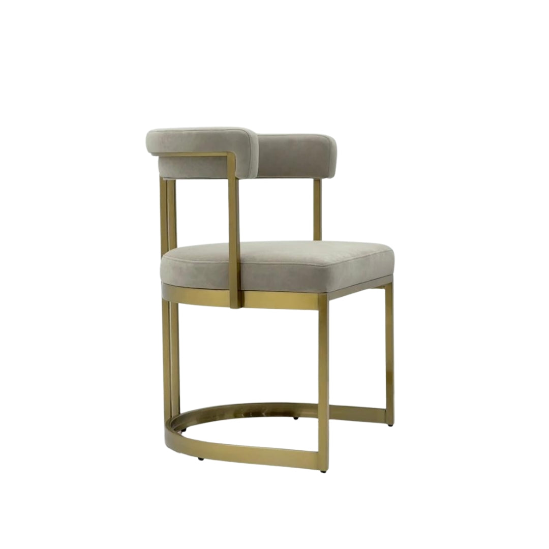 Lusso velvet dining chair, side view showing gold frame