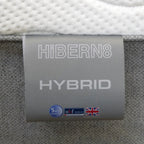 Hibern8 hybrid mattress tag with branding and certification logos.