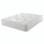 A white tufted mattress shown at an angle on a clean white background.
