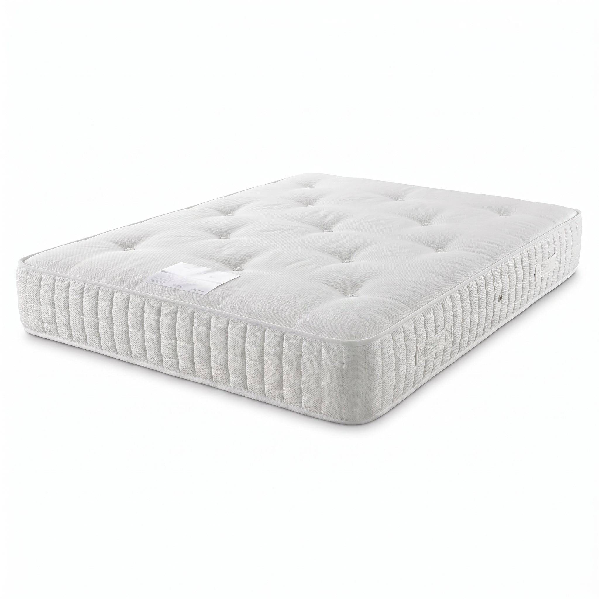 A white tufted mattress shown at an angle on a clean white background.