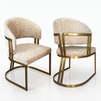 Two Clubhouse mink boucle dining chairs with brushed brass frames