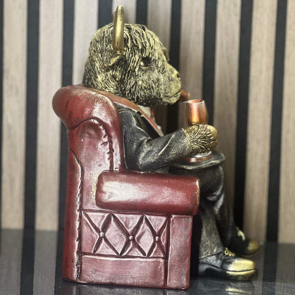 Highland Cow in Armchair Home Ornament Lesser & Pavey Ltd