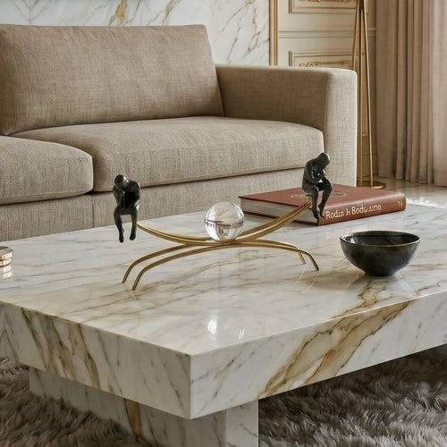 Modern living room with marble coffee table, beige sofa, and cityscape view.