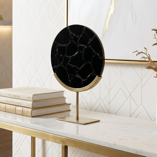 Modern interior with a marble table, books, and decorative items.